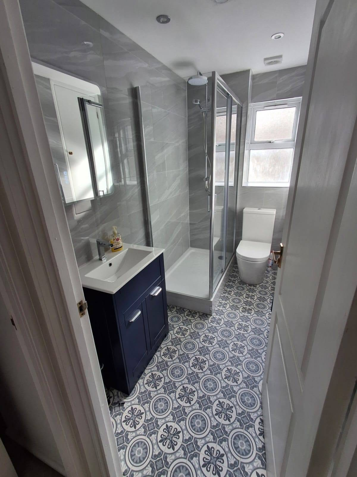 Navy Vanity Shower Room with Patterned Floor